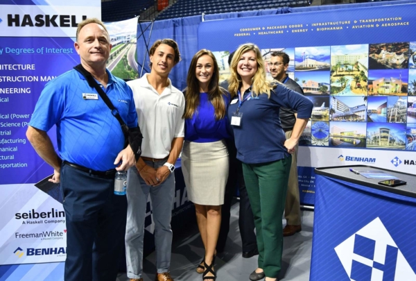 Haskell employees pose at college career fair.