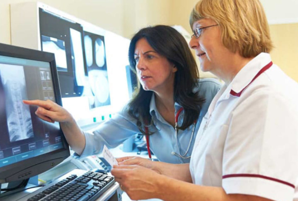 Two women looking at an x-ray.