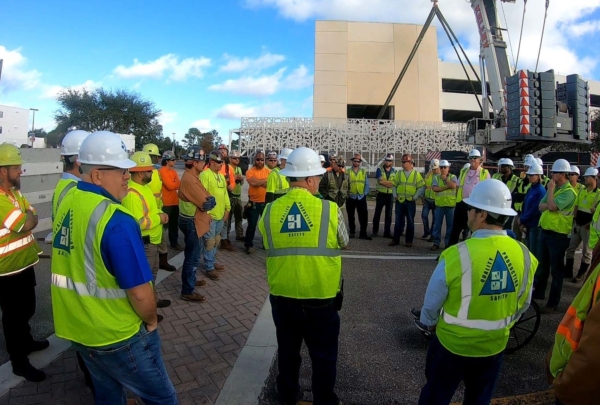 Haskell team members participating in a safety meeting on a job site.