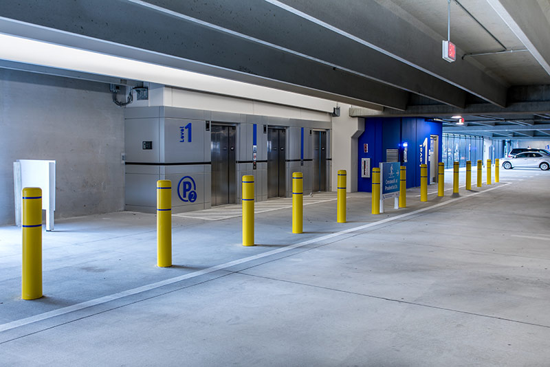 Photo of the elevators and signs within the Baptist Medical center parking structure