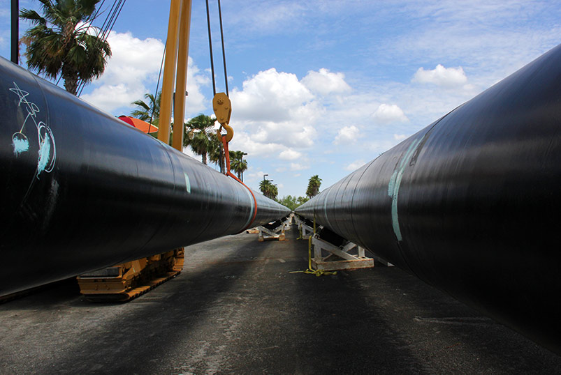 Two large black pipes at eye level on jobsite