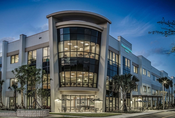 Exterior view of Jupiter Medical Center at dusk