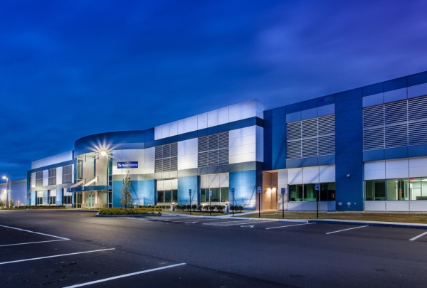 Front entrance of SAFRAN Aerospace Composite Facility in the evening.