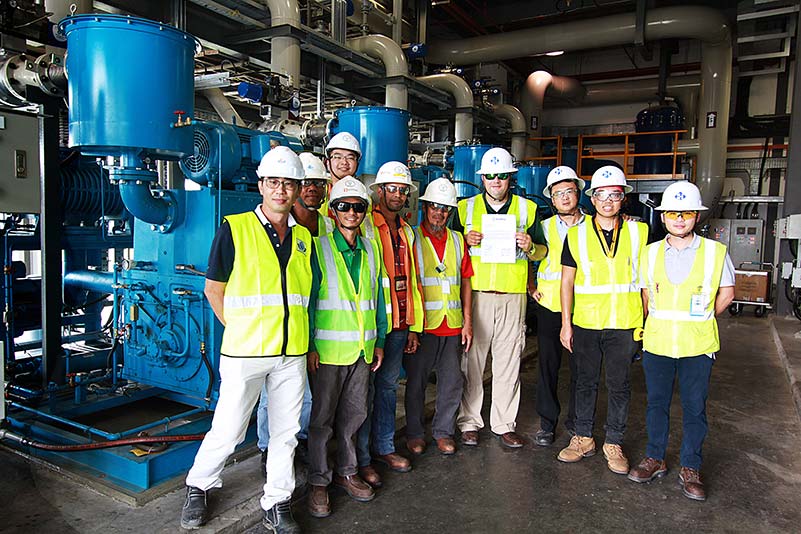 Ten Haskell team members standing inside SAFRAN Landing Systems.